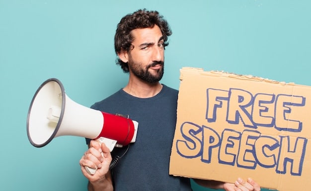 A person holding a megaphone with the words 
