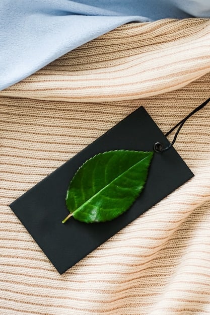 A close-up shot of a tag on a garment from a sustainable fashion drop, highlighting the eco-friendly materials used in its production, such as organic cotton or recycled fibers.