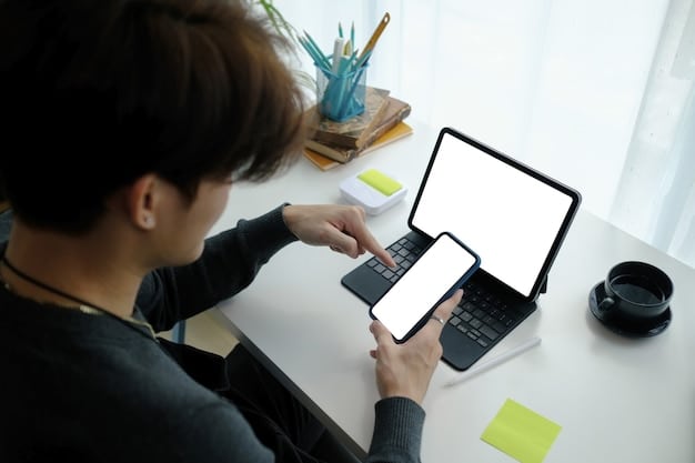 A close-up shot of a person using multiple devices (phone, laptop, tablet) to monitor online stores and social media feeds for upcoming fashion drops, highlighting the fast-paced and tech-savvy nature of the business.