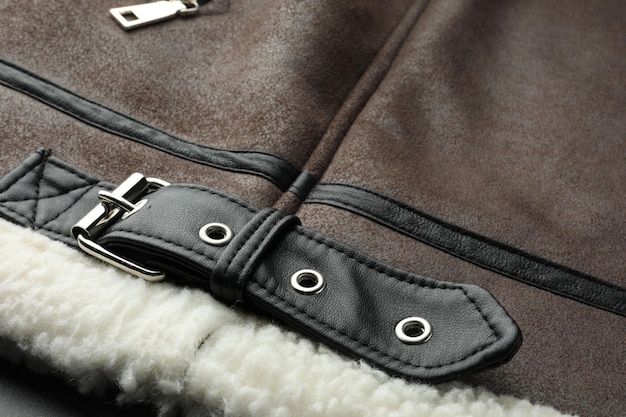 A detailed shot showcasing the texture and stitching of a high-quality leather jacket, emphasizing the durability and fine craftsmanship. The jacket is presented against a neutral background to highlight its premium features.