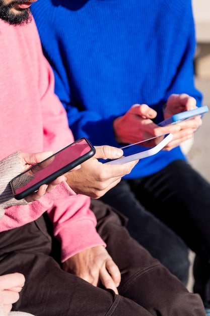 A close-up shot of multiple hands holding different smartphones displaying vibrant fashion forum feeds, highlighting discussions about upcoming fashion drops, release dates, and style recommendations.