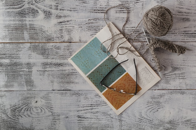 A split image: on one side, a mood board filled with sketches, fabric swatches, and inspirational photos related to an upcoming designer collaboration. On the other side, a promotional graphic showcasing the launch date of a highly anticipated limited edition release, alongside a countdown timer. The image represents the anticipation surrounding fashion drops.